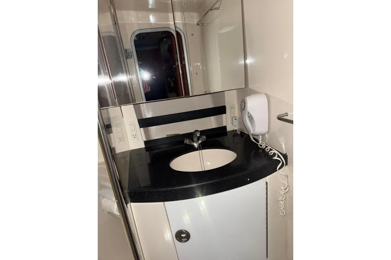 Slide: The Image of 2009 Regal Commodore 3760 IO boat propellers in a garage setting. - 23