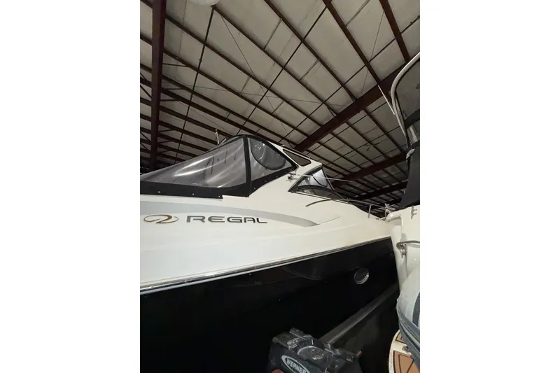 Slide: The Image of 2009 Regal Commodore 3760 IO boat in storage, featuring radar equipment. - 5