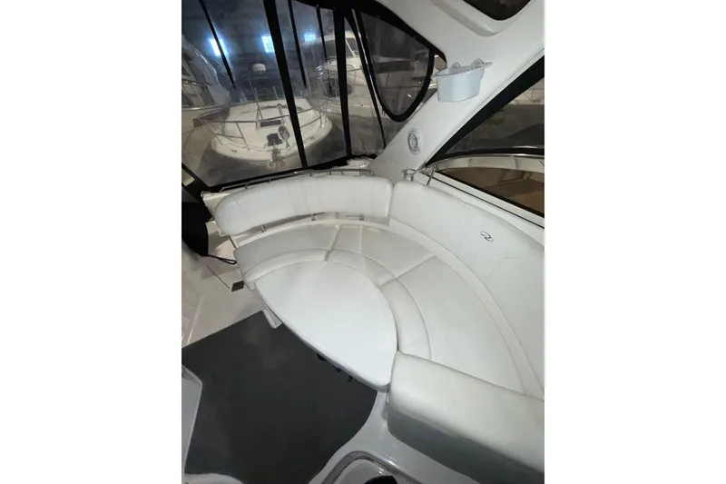 Slide: The Image of 2009 Regal Commodore 3760 IO interior with white seating and control panel. - 7