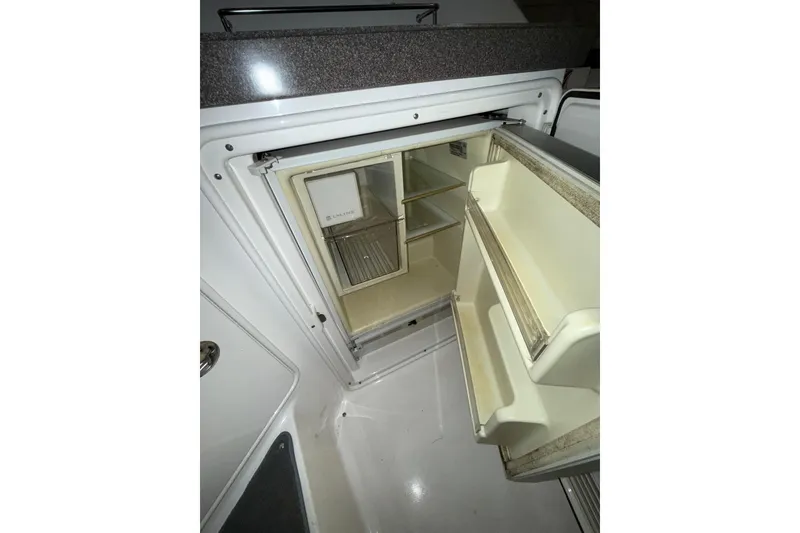 Slide: The Image of 2009 Regal Commodore 3760 IO boat interior with seating and counter space. - 8