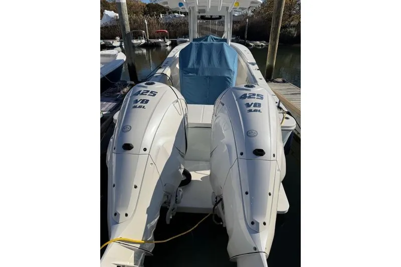 Slide: The Image of 2023 Regulator 31 boat with twin 425 V8 engines docked at marina. - 20