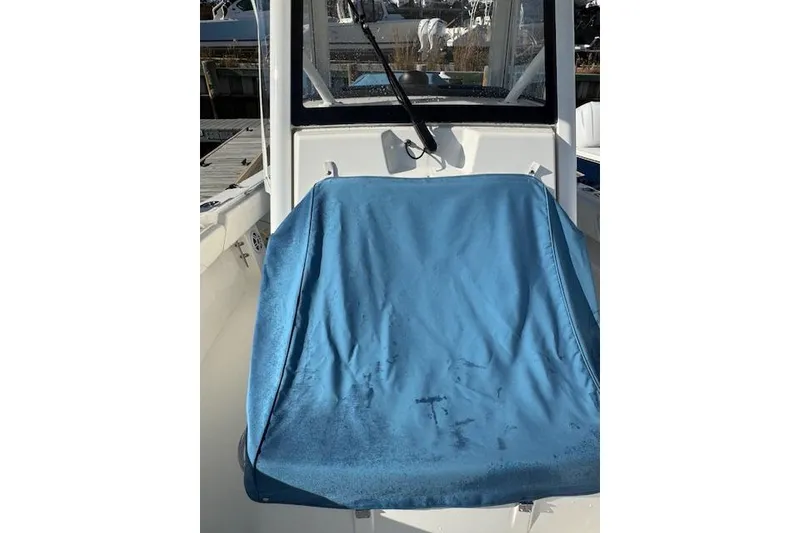 Slide: The Image of 2023 Regulator 31 boat with blue seat cover in cockpit area. - 26