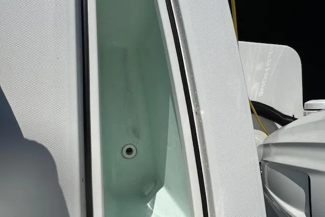 Slide: The Image of 2023 Regulator 31 boat deck with storage compartment open. - 27