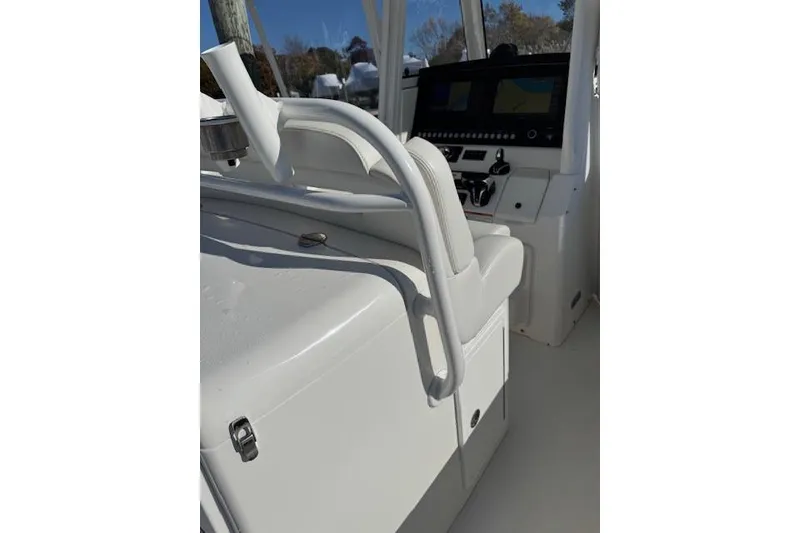 Slide: The Image of 2023 Regulator 31 boat interior with helm and seating area. - 51
