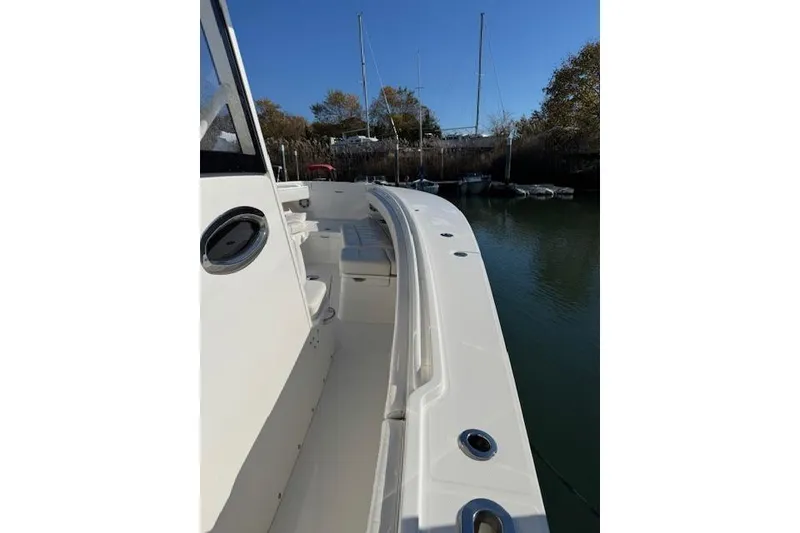 Slide: The Image of 2023 Regulator 31 boat deck view with seating and rod holders. - 52