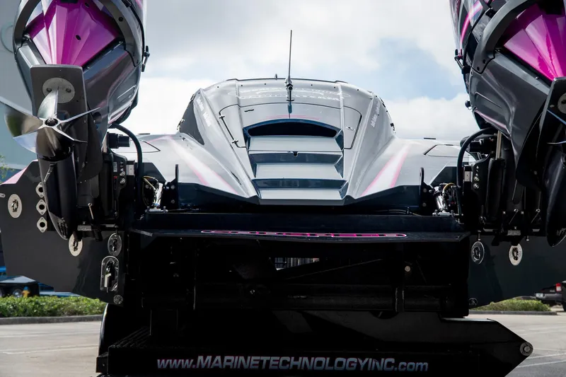 Slide: The Image of 2023 MTI 390XR powerboat rear view with dual engines, showcasing sleek design. - 34