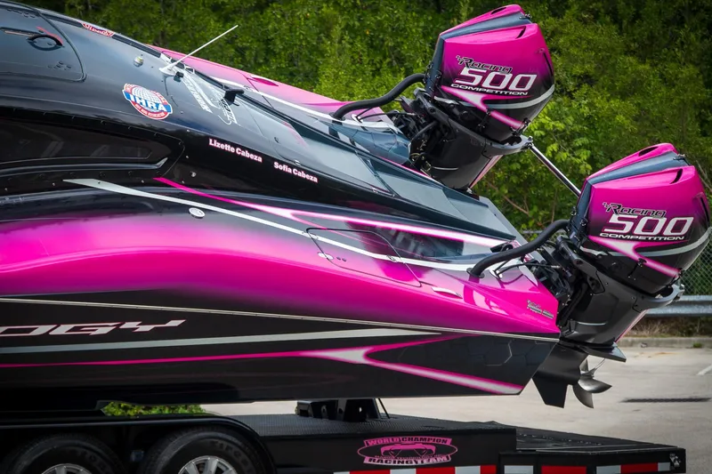 Slide: The Image of 2023 MTI 390XR powerboat with vibrant pink design and dual Racing 500 engines. - 5