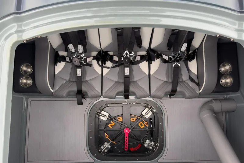 Slide: The Image of Interior of 2023 MTI 390XR boat with harnessed seats and control panel. - 58