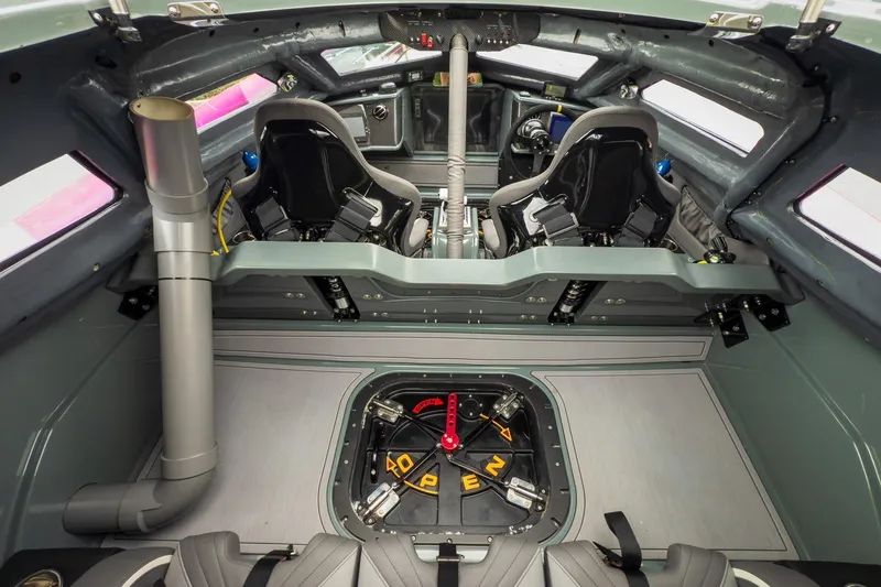 Slide: The Image of Interior of a 2023 MTI 390XR boat, featuring advanced seating and control systems. - 60