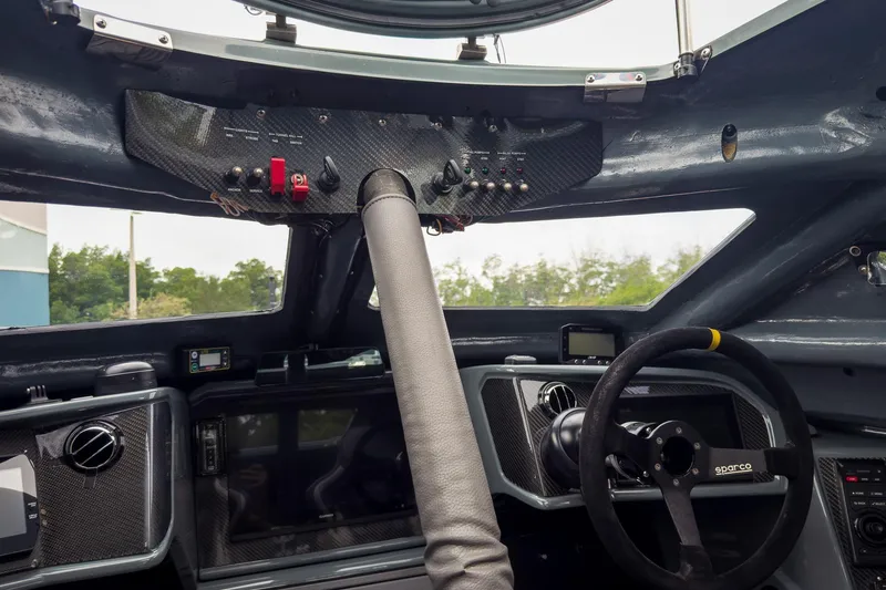 Slide: The Image of Interior of 2023 MTI 390XR cockpit with advanced controls and steering wheel. - 63