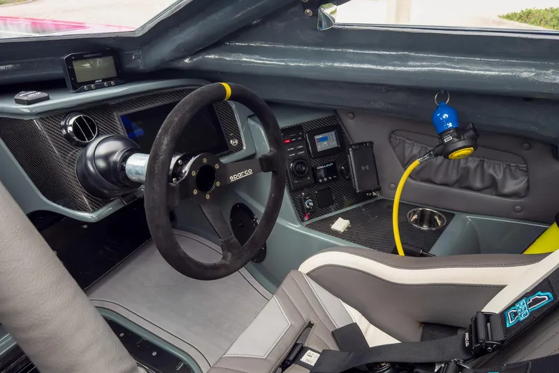 Slide: The Image of Interior of 2023 MTI 390XR with Sparco steering wheel and advanced dashboard controls. - 66
