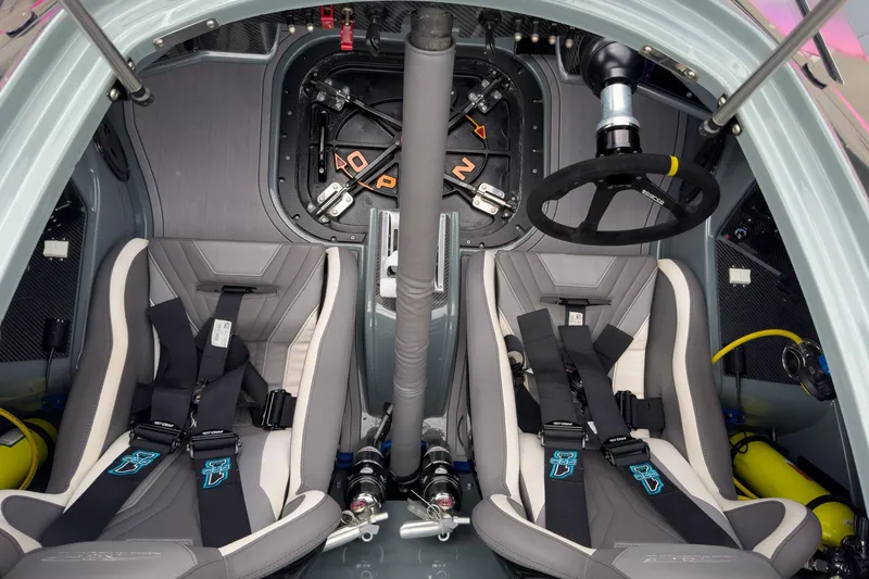 Slide: The Image of Interior of 2023 MTI 390XR boat with dual racing seats and steering wheel. - 67