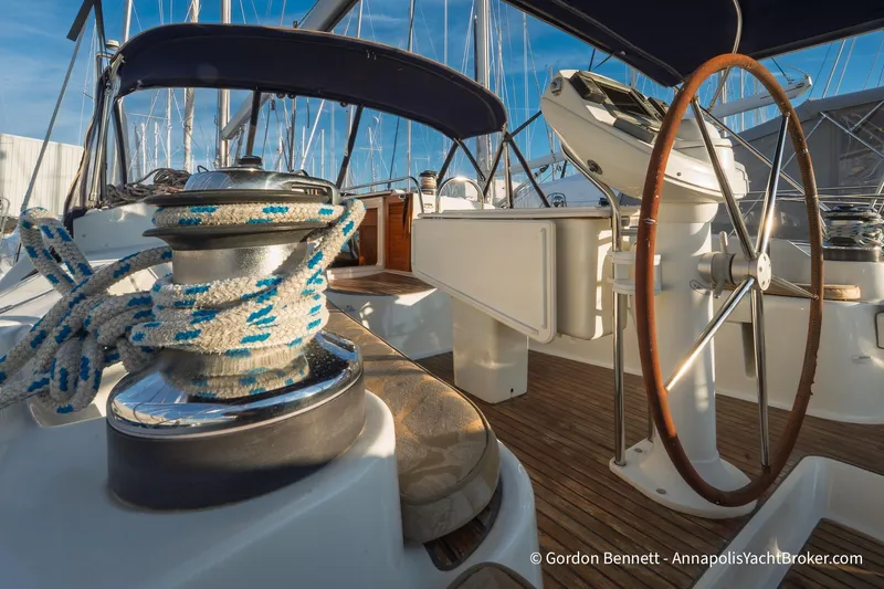 Slide: The Image of 2004 Jeanneau Sun Odyssey 43 DS yacht cockpit with steering wheel and winch. - 11