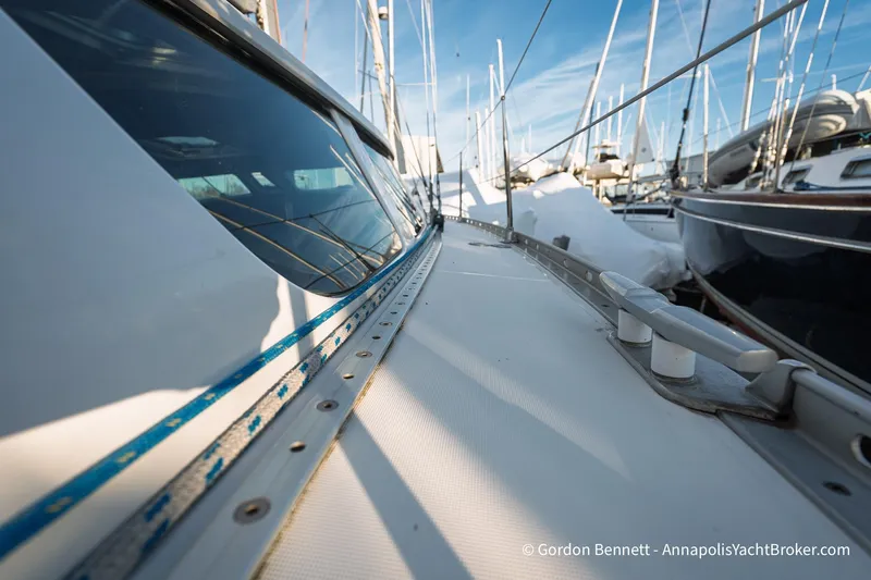 Slide: The Image of 2004 Jeanneau Sun Odyssey 43 DS sailboat deck view with marina background. - 15