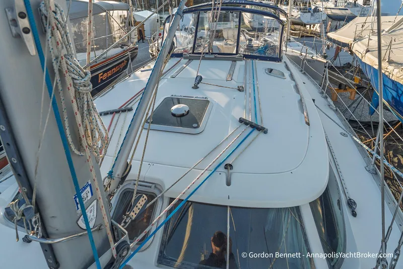 Slide: The Image of 2004 Jeanneau Sun Odyssey 43 DS sailboat deck with rigging and ropes in marina. - 19