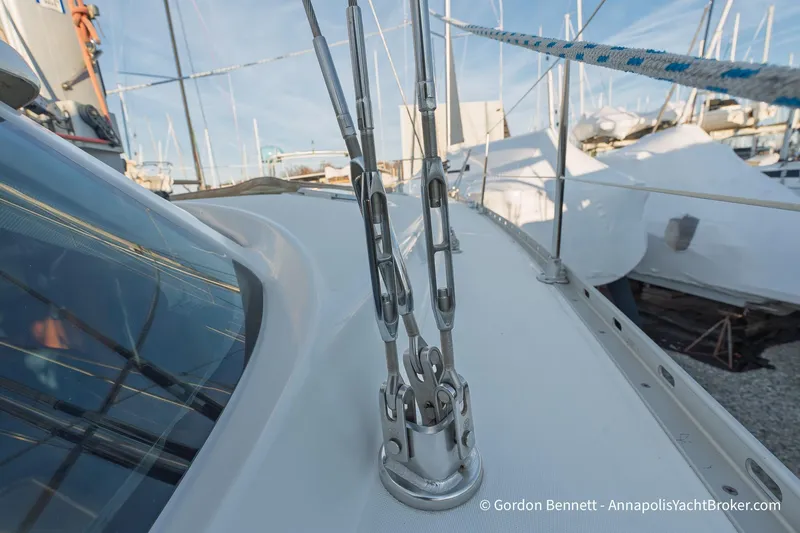 Slide: The Image of 2004 Jeanneau Sun Odyssey 43 DS sailboat deck with rigging details in marina. - 23