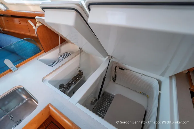 Slide: The Image of Interior view of 2004 Jeanneau Sun Odyssey 43 DS yacht, featuring open storage compartments. - 37