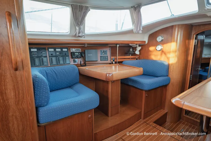 Slide: The Image of Interior of 2004 Jeanneau Sun Odyssey 43 DS yacht with blue seating and navigation equipment. - 41