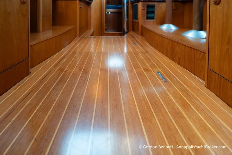 Slide: The Image of Interior view of 2004 Jeanneau Sun Odyssey 43 DS with polished wooden flooring. - 43