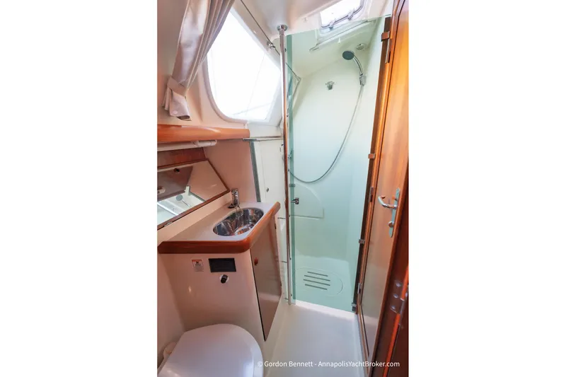 Slide: The Image of Bathroom interior of 2004 Jeanneau Sun Odyssey 43 DS yacht, featuring shower and sink. - 47