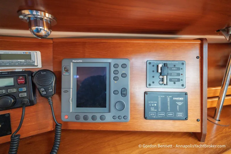 Slide: The Image of Control panel of 2004 Jeanneau Sun Odyssey 43 DS yacht with navigation and communication equipment. - 53