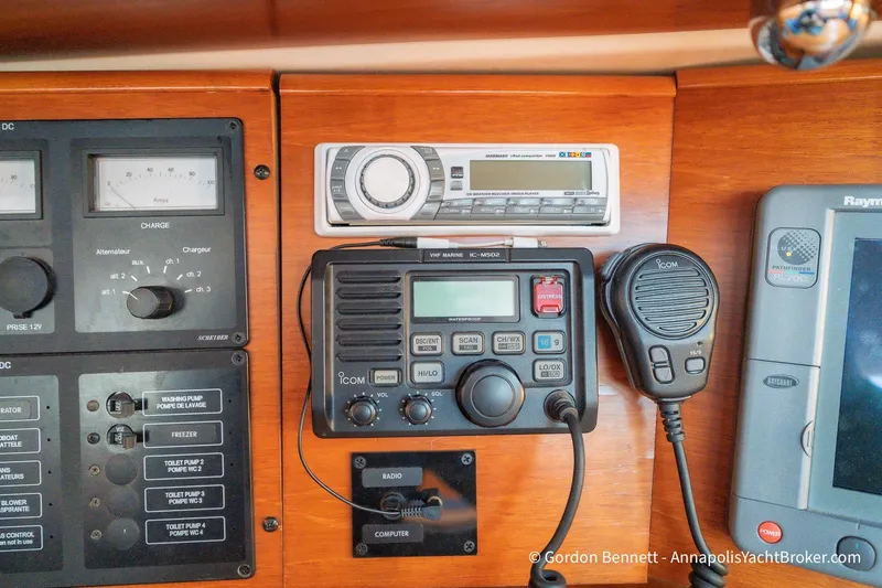 Slide: The Image of Control panel of a 2004 Jeanneau Sun Odyssey 43 DS yacht with radio and navigation equipment. - 54