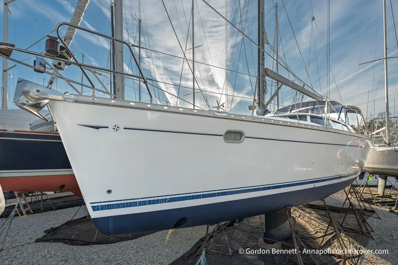Slide: The Image of 2004 Jeanneau Sun Odyssey 43 DS sailboat on dry dock, side view. - 6