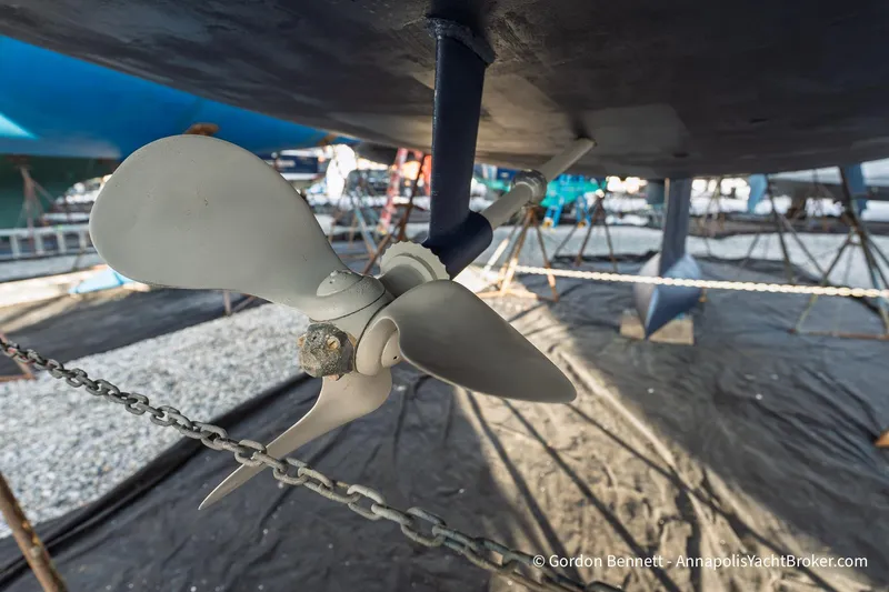 Slide: The Image of Propeller of 2004 Jeanneau Sun Odyssey 43 DS sailboat in dry dock. - 64