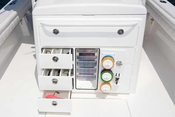 Slide: The Image of 2021 Regulator 34 boat storage unit with organized drawers and compartments. - 11