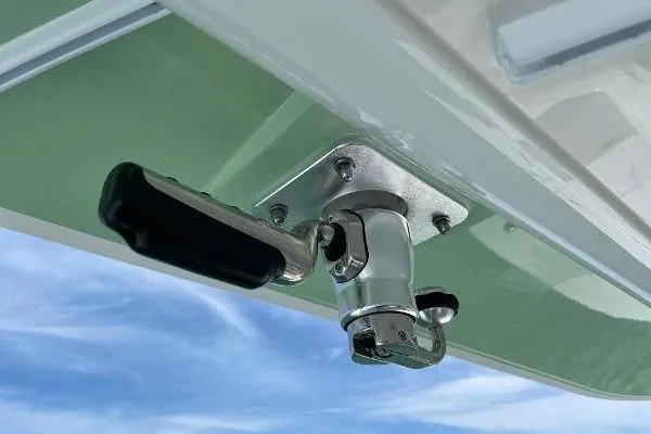 Slide: The Image of 2021 Regulator 34 boat detail showing a mounted handle against a blue sky. - 20