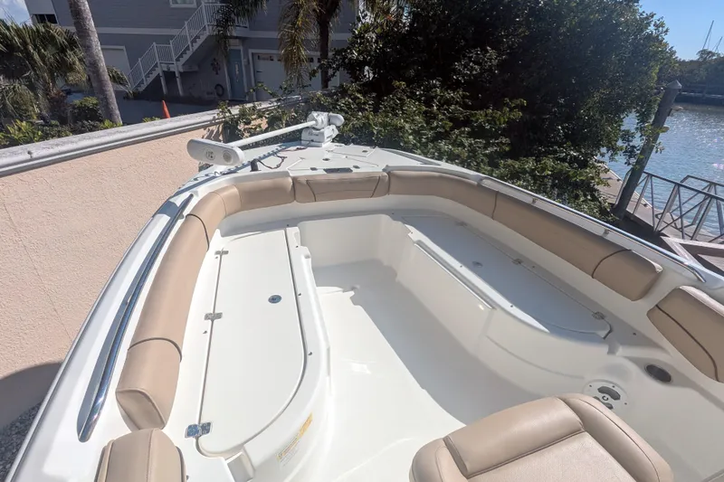 Slide: The Image of 2020 NauticStar 251 Hybrid boat with spacious seating and sleek design. - 9