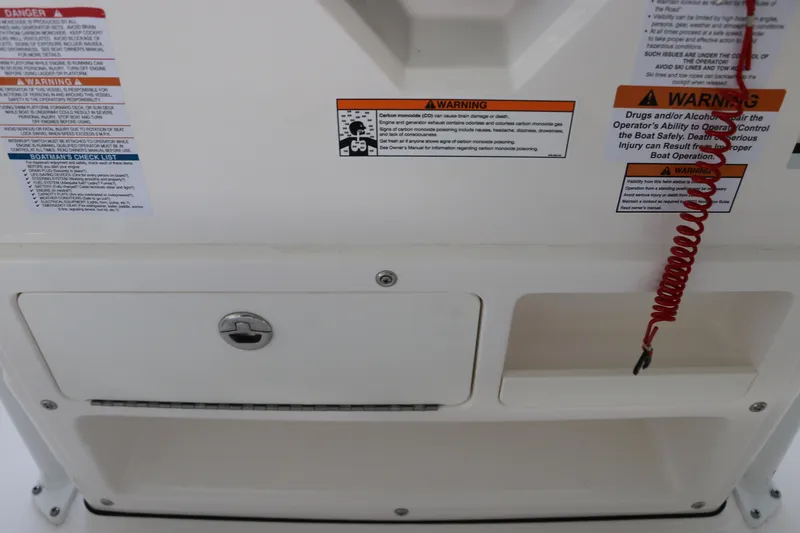 Slide: The Image of 2026 Robalo R202 Explorer dashboard with safety warnings and red coiled cord. - 25