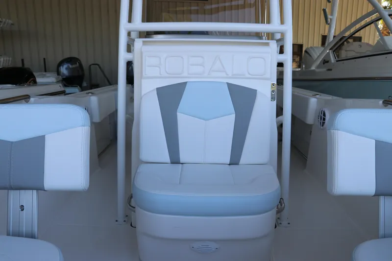 Slide: The Image of 2026 Robalo R202 Explorer boat interior with open storage compartment. - 28