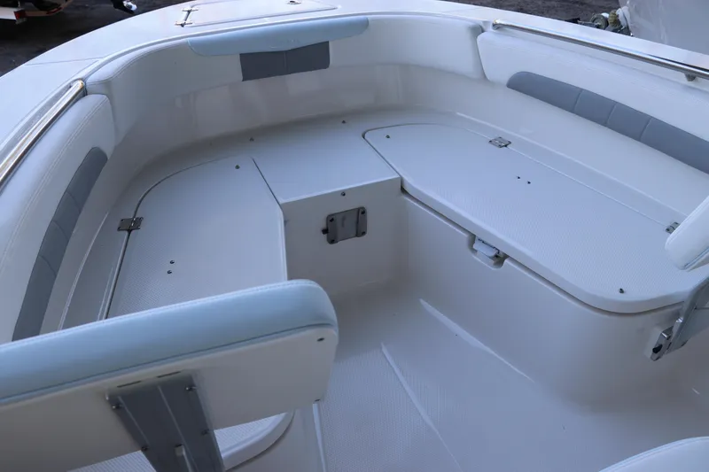 Slide: The Image of Open storage compartment on 2026 Robalo R202 Explorer boat, showcasing spacious interior design. - 37