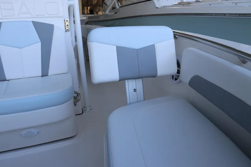 Slide: The Image of 2026 Robalo R202 Explorer boat deck with storage compartment and latch. - 40