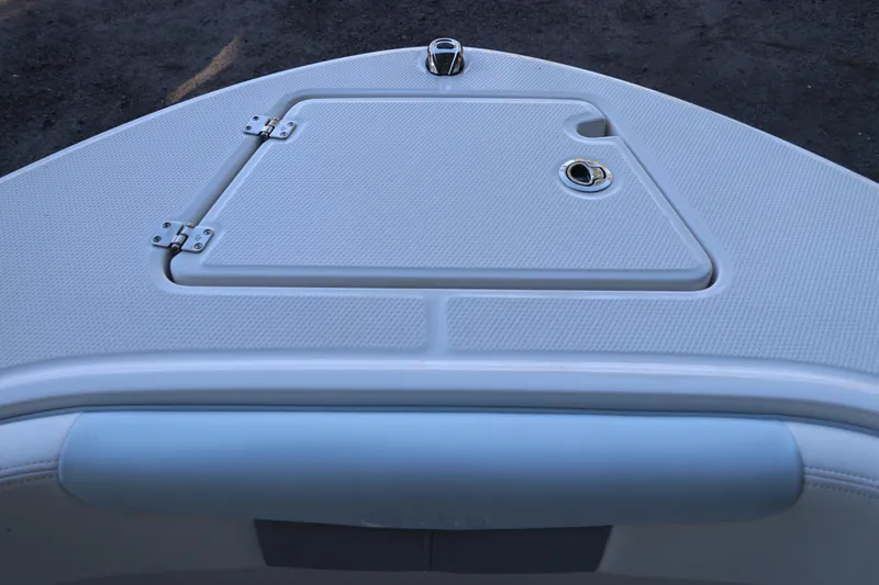 Slide: The Image of 2026 Robalo R202 Explorer anchor storage compartment with open lid. - 41