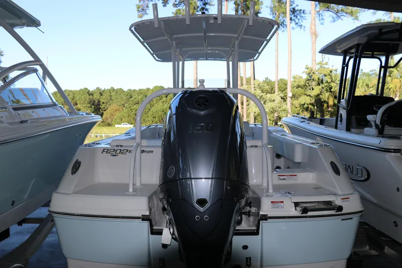 Slide: The Image of 2026 Robalo R202 Explorer boat on trailer, outdoor setting, rear view. - 5