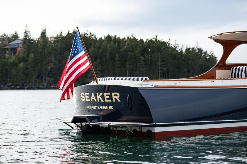 Slide: The Image of 2001 Hinckley Picnic Boat Classic with American flag, Southwest Harbor, Maine. - 50