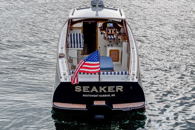Slide: The Image of 2001 Hinckley Picnic Boat Classic on water, American flag, Southwest Harbor, ME. - 7