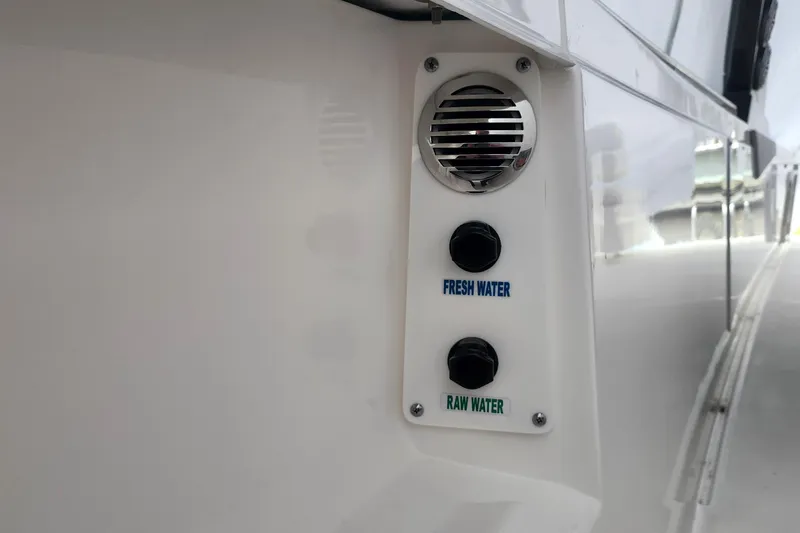 Slide: The Image of 2026 Tiara Yachts 34 LS water controls, featuring fresh and raw water options. - 14