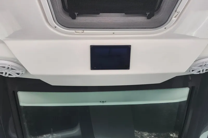 Slide: The Image of 2026 Tiara Yachts 34 LS interior detail with speakers and window. - 16