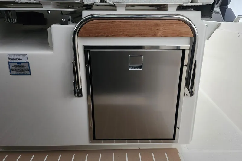 Slide: The Image of Stainless steel compartment on 2026 Tiara Yachts 34 LS, featuring sleek design and wood accents. - 21
