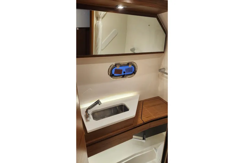 Slide: The Image of Luxurious bathroom interior of 2026 Tiara Yachts 34 LS with modern sink and mirror. - 28