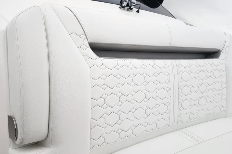 Slide: The Image of Luxurious white seating detail on 2026 Tiara Yachts 34 LS with hexagonal stitching. - 32