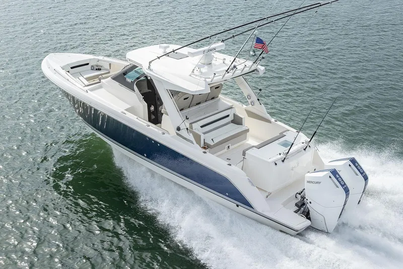 Slide: The Image of Manufacturer Provided Image: 2025 Tiara Yachts 34 LS cruising on water, showcasing sleek design and powerful engines. - 34