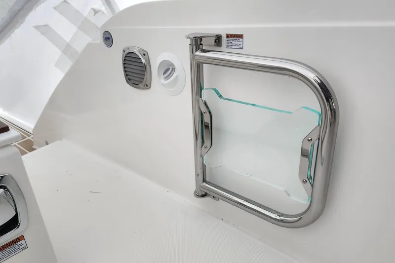 Slide: The Image of 2026 Tiara Yachts 34 LS boat interior with stainless steel and glass safety gate. - 5