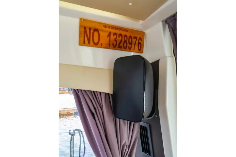 Slide: The Image of Interior of 2015 Jeanneau NC 14 with USCG documentation number displayed. - 28
