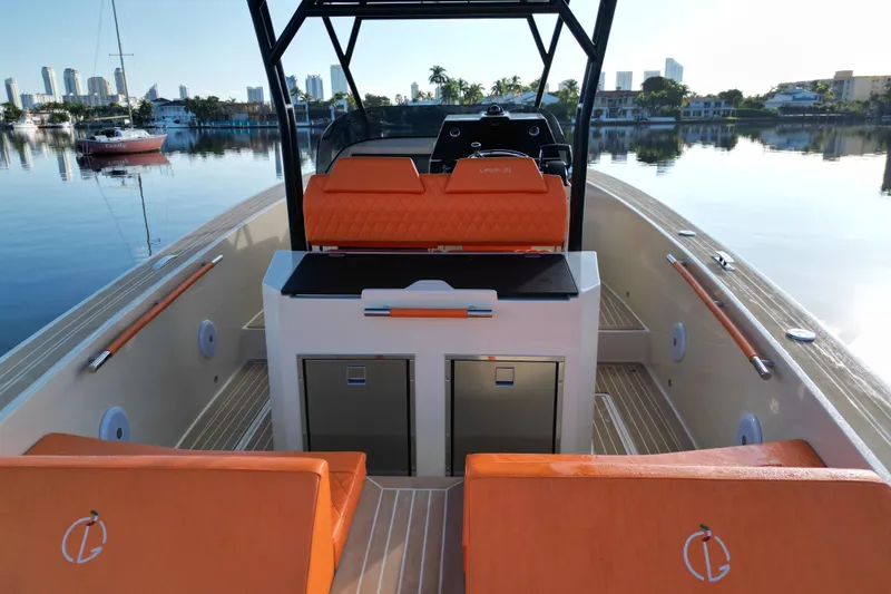 Slide: The Image of 2026 Lilybaeum Lipari 31 boat interior with orange seating, sleek design, and modern controls. - 23
