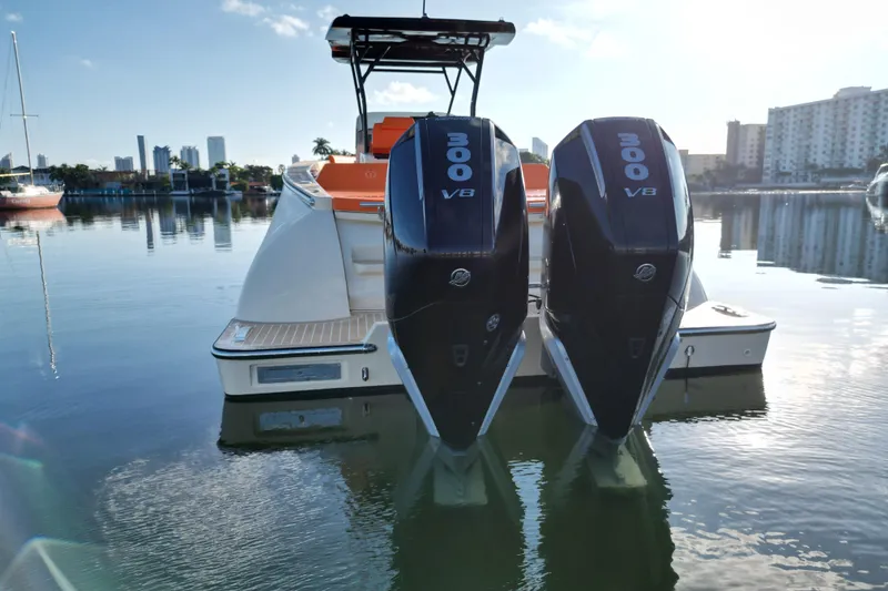 Slide: The Image of 2026 Lilybaeum Lipari 31 boat with dual Mercury engines on calm water. - 28