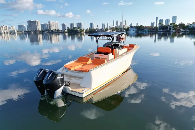 Slide: The Image of Lilybaeum Lipari 31 boat on calm water, city skyline in background, 2026 model. - 6